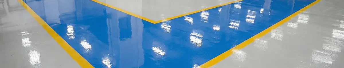 A factory floor professionally covered and marked with epoxy flooring in Denver, CO