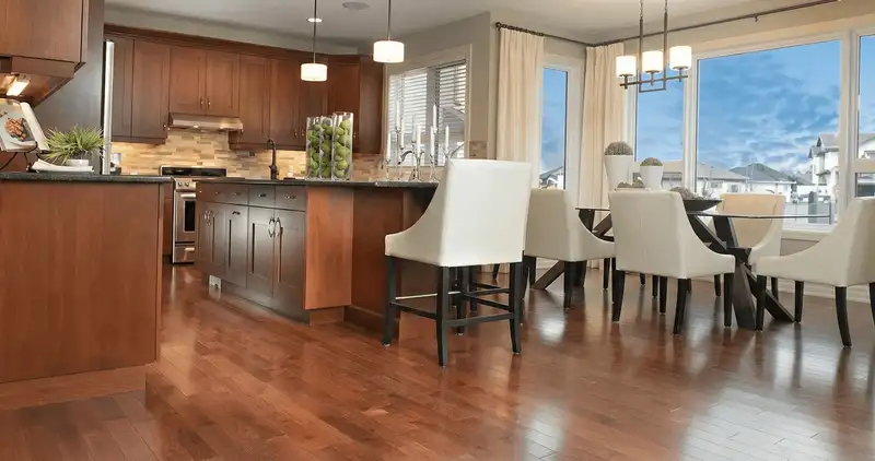 A modern kitchen with professionally installed wood flooring in Denver, CO