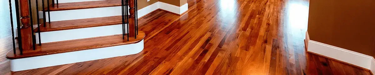 Base floor of a staircase with professionally restored wood flooring in Denver CO