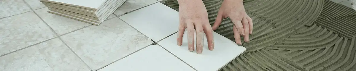 Professional installing white tile floors in Denver, CO