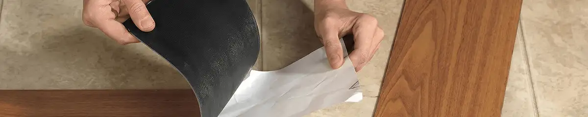 A professional installing vinyl flooring in Denver, CO